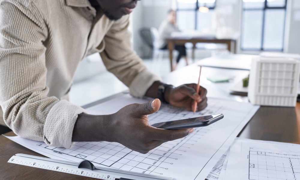 engineer-drawing-a-blueprint engineer-drawing-a-blueprint